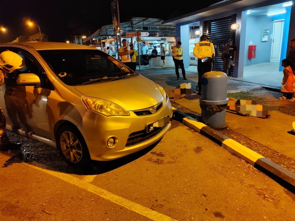The Perodua Alza where three Myanmar citizens were found dead at the Yong Peng (southbound) lay-by of the North-South Expressway in Johor July 18, 2023. — Picture courtesy of the Johor Fire and Rescue Department 