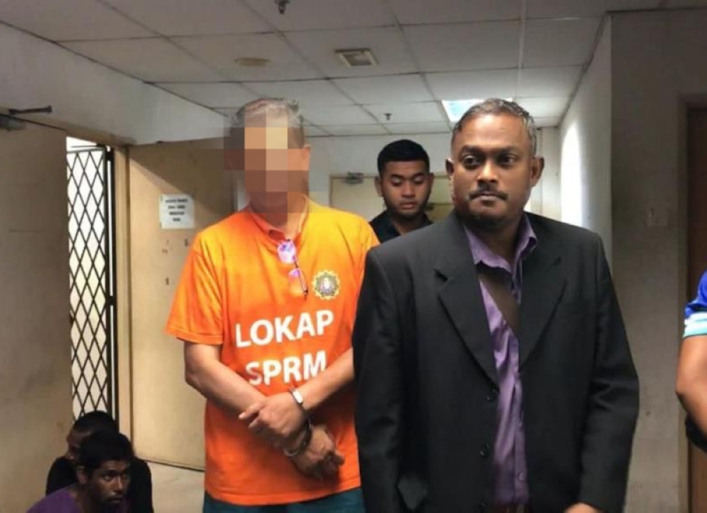 According to a Malaysian Anti-Corruption Commission (MACC) source, the suspects, aged 63 and 40, are being remanded for three days until Friday (July 21), after being arrested late last night in Alor Setar and Kuala Lumpur. ― Picture from Twitter/SPRMMalaysia via Bernama 