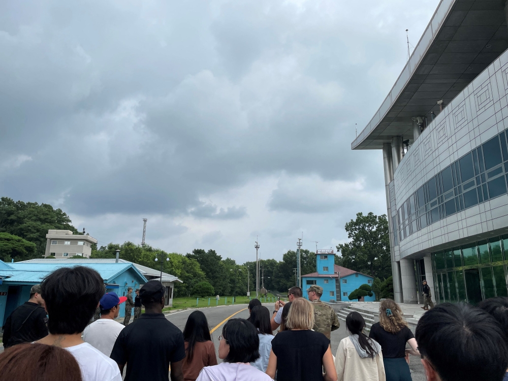 US Private Travis T. King (wearing a black shirt and black cap) is seen in this picture taken during a tour of the tightly controlled Joint Security Area (JSA) on the border between the two Koreas, at the truce village of Panmunjom, South Korea, July 18, 2023. — Sarah Leslie handout via Reuters