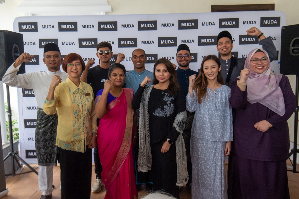 Muda candidates pose for a group picture at Muda’s command centre in Petaling Jaya July 22, 2023. — Picture by Shafwan Zaidon