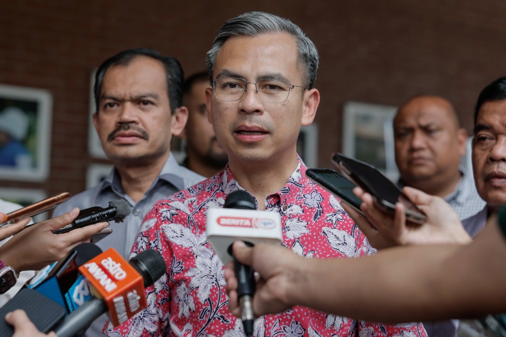 Communications and Digital minister Fahmi Fadzil speaks to reporters after a Madani Community event in Kuala Lumpur July 22, 2023. — Bernama pic