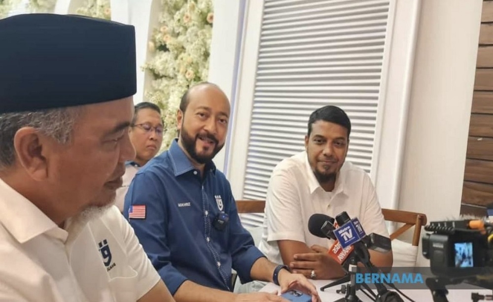 Pejuang president Datuk Seri Mukhriz Mahathir (in blue) said the party will not be fielding any candidates in the state elections next month. — Picture via Twitter/Bernama