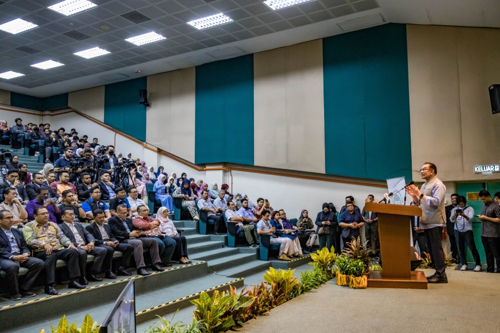 Prime Minister Datuk Seri Anwar Ibrahim speaks at the ‘Perkampungan Menara Gading Kebangsaan 2023’ event at Universiti Malaya in Kuala Lumpur July 22, 2023. — Picture by Firdaus Latif 
