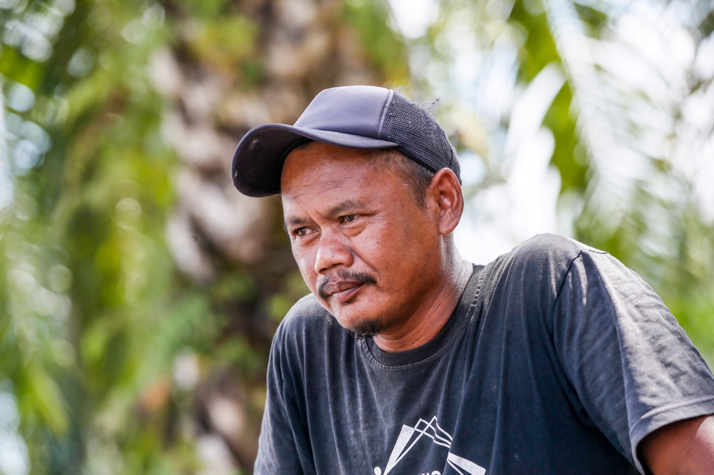 Paddy farmer Razuan Rasidin, 43 speaks to Malay Mail at Tanjung Karang, Selangor July 11, 2023. — Picture  by Hari Anggara