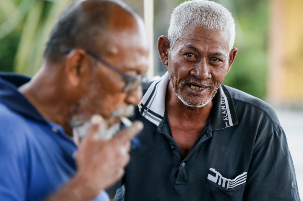 Fisherman Hamsan Sahudin 61, speaks to Malay Mail during an interview session at Sungai Haji Dorani jetty, July 12, 2023. — Picture by Hari Anggara