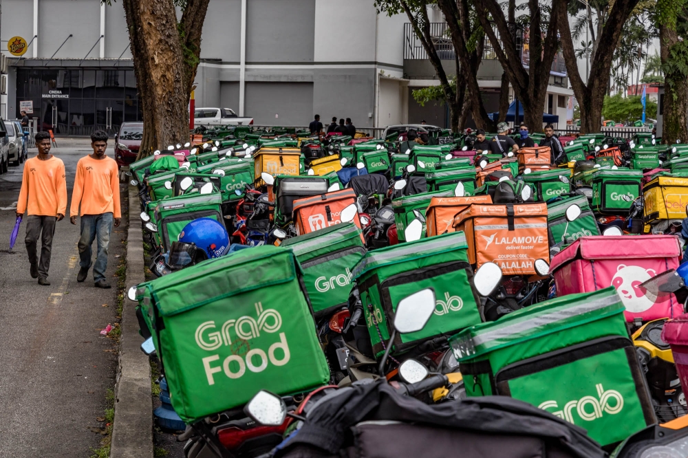 A general view of p-hailing riders’ motorcycles at the ‘Himpunan Rider Madani’ event at Laman MBPJ in Petaling Jaya July 22, 2023. — Picture by Firdaus Latif