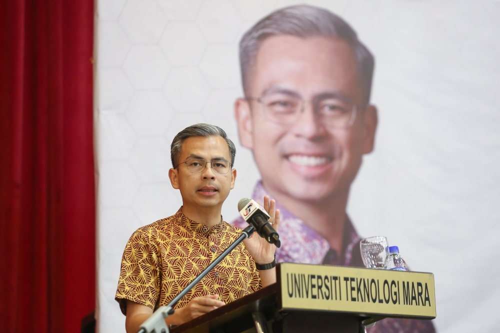 Communications and Digital Minister Fahmi Fadzil expressed concern today over an online video with images of Kedah caretaker Menteri Besar Datuk Seri Muhammad Sanusi and weapons, saying it could be construed as threatening. — Picture by Yusof Mat Isa