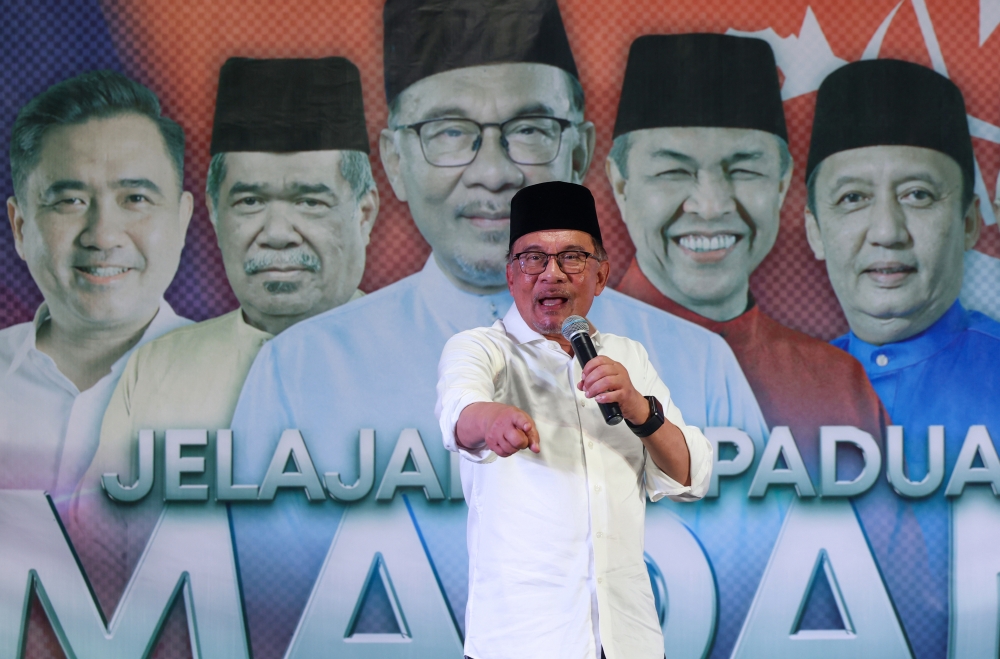 Prime Minister Datuk Seri Anwar delivers a speech at the Madani Unity Tour and launch of the Unity Machinery in Kelantan, near Bukit Tiu in Machang July 23, 2023. — Bernama pic