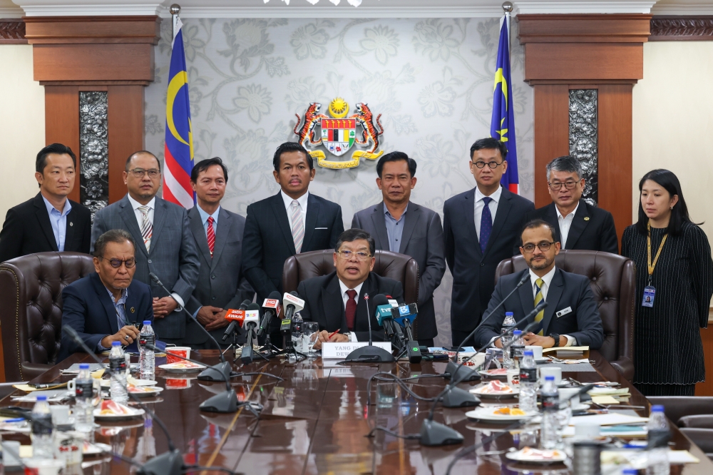 Dewan Rakyat Speaker Tan Sri Johari Abdul (seated, centre) at a press conference on the Members of the 15th Parliamentary Special Select Committee at Parliament Building, June 6, 2023. — Bernama pic