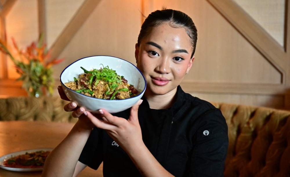 Chef Tue Nguyen presents a bowl of her Didi fried rice at her soon-to-open first restaurant, called Di Di (Let's Go! in Vietnamese), in West Hollywood, California July 10, 2023. — AFP pic