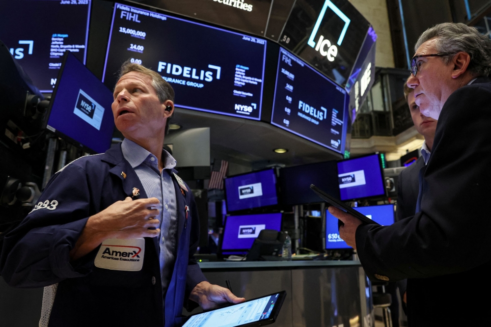 The Dow Jones Industrial Average rose 26.83 points, or 0.08 per cent, to 35,438.07, the S&P 500 gained 12.82 points, or 0.28 per cent, to 4,567.46 and the Nasdaq Composite added 85.69 points, or 0.61 per cent, to 14,144.56. ― Reuters pic