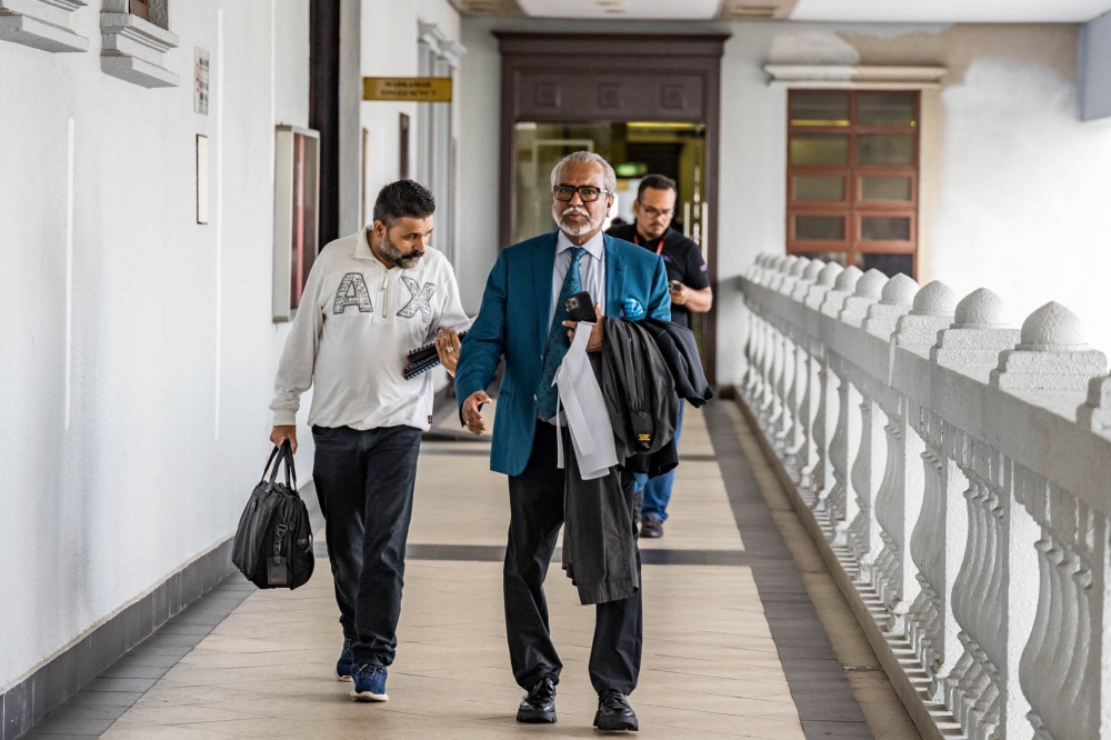 Lawyer Tan Sri Muhammad Shafee Abdullah is pictured at the Kuala Lumpur Court Complex, in Kuala Lumpur July 27, 2023. — Picture by Firdaus Latif