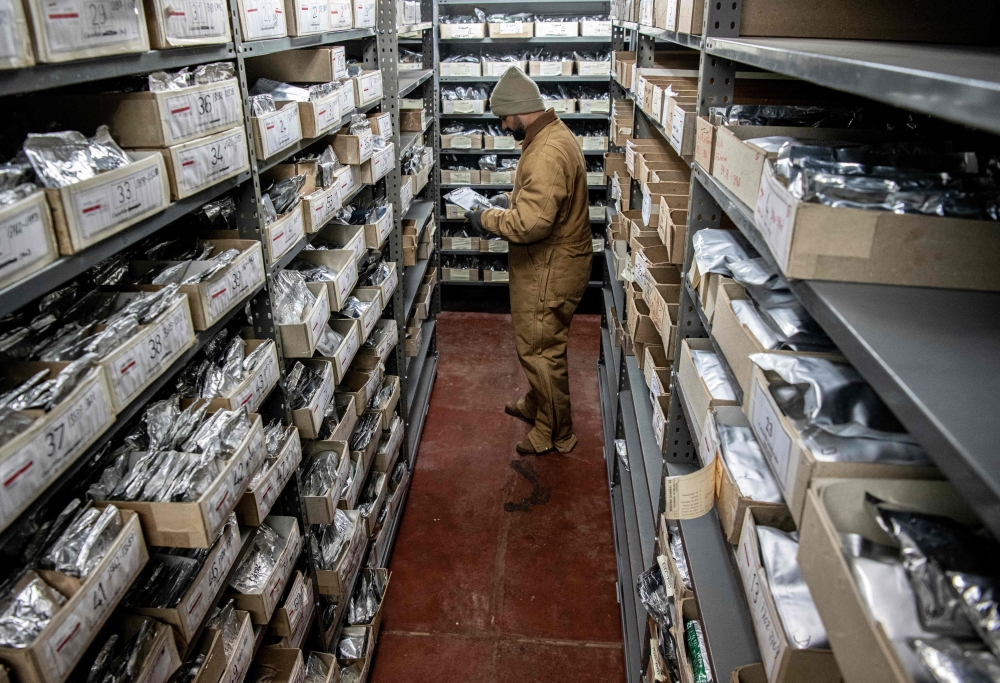 A scientist stores seeds at the seed bank of the Tropical Agricultural Research and Higher Education Center (CATIE), in Turrialba, Costa Rica, on July 19, 2023. — AFP pic