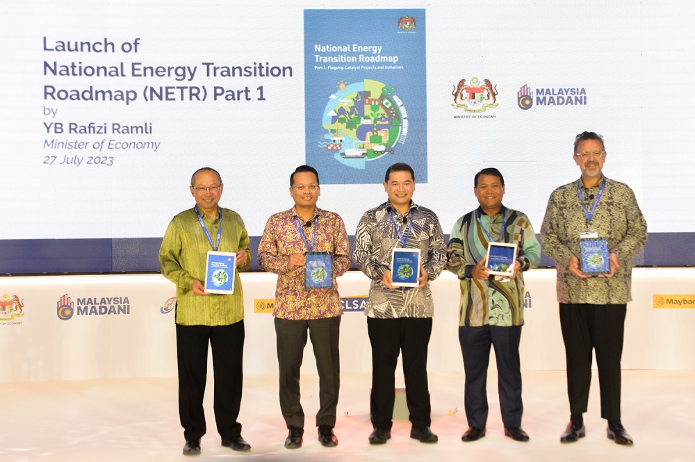  Economy Minister Rafizi Ramli (centre) was seen during the launch of the National Energy Transition Roadmap in Kuala Lumpur July 27, 2023. — Picture by Miera Zulyana