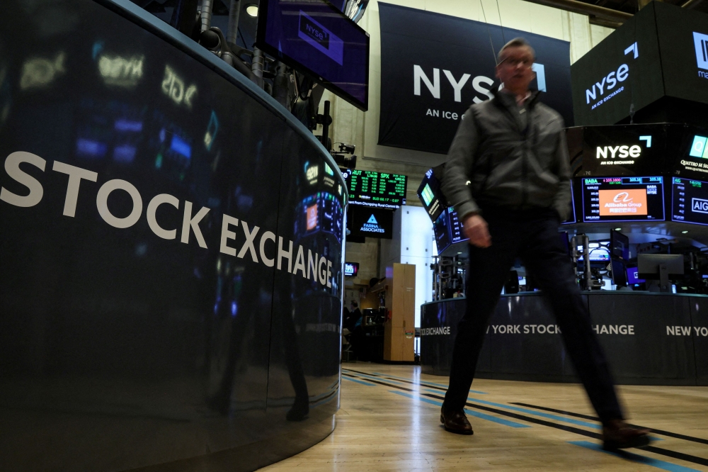 Wall Street opened higher today after data signalling easing inflation pressures added to hopes that the Federal Reserve’s policy tightening was ending, while chip stocks rose as Intel posted a surprise quarterly profit. ― Reuters pic