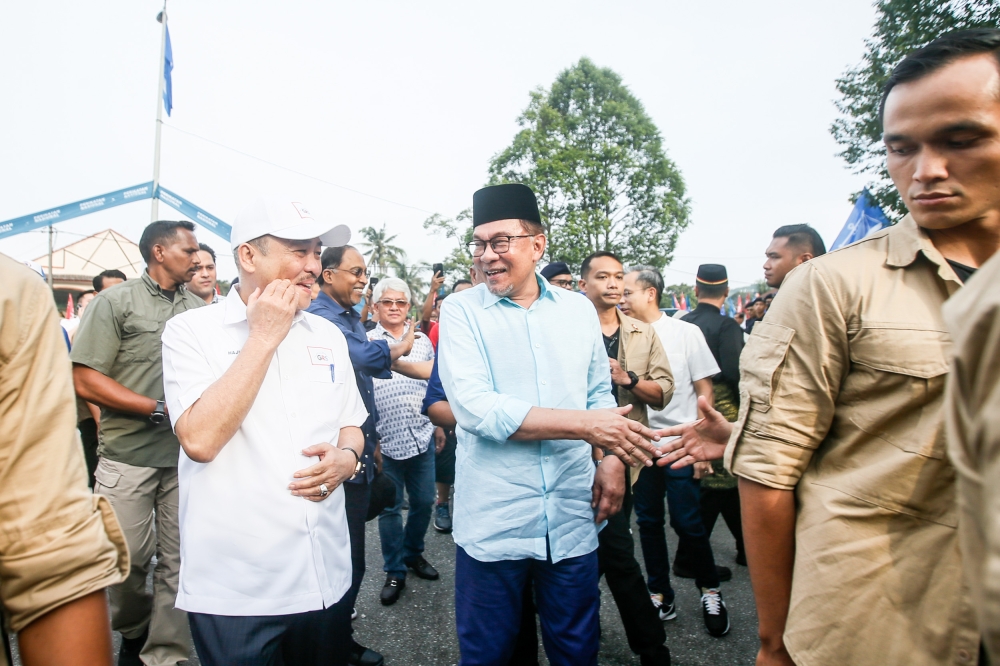 Prime Minister Datuk Seri Anwar Ibrahim arrives at the nomination centre at SMK sungai pusu to support the unity government’s candidates, July 29, 2023. — Picture by Hari Anggara