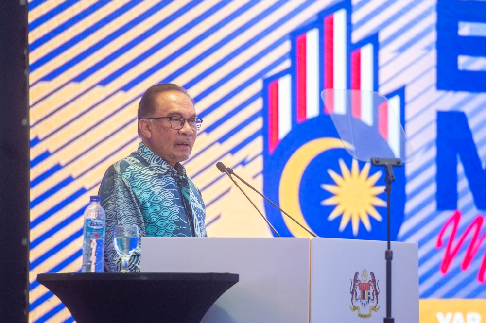 Prime Minister Datuk Seri Anwar Ibrahim speaks during the launch of the 'Madani Economy Empowering the People' framework in Kuala Lumpur on 27 July 2023. ―  Picture by Shafwan Zaidon