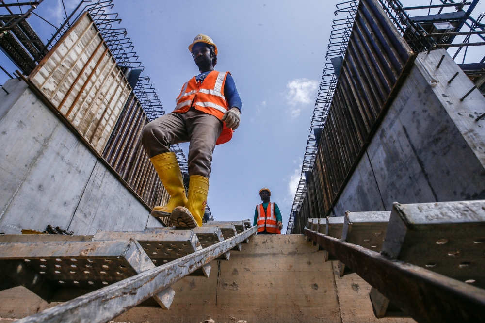 Construction workers for the East Coast Rail Link (ECRL) project are completing the Wildlife Box Crossing section at the Kemasul forest reserve in Pahang March 6, 2023. — File picture by Hari Anggara
