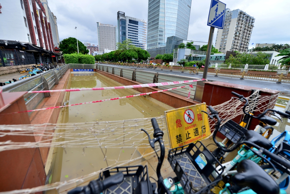 A flooded pedestrian tunnel is seen behind cordon lines after Typhoon Doksuri made landfall in Fuzhou, Fujian province, China July 29, 2023. — Reuters pic