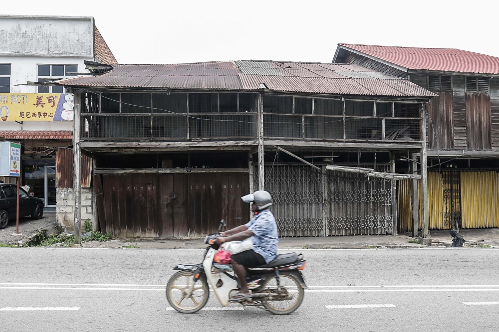 Several dilapidated shop lots are seen in Rantau, Negeri Sembilan July 23, 2023. — Picture by Sayuti Zainudin