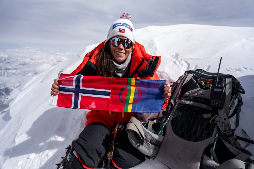 In this handout picture taken on April 26, 2023 by courtesy of Field Productions shows Norwegian climber Kristin Harila with her country flag at Shishapangma, 14th-highest mountain in the world, located in China. — Handout pic via AFP 
