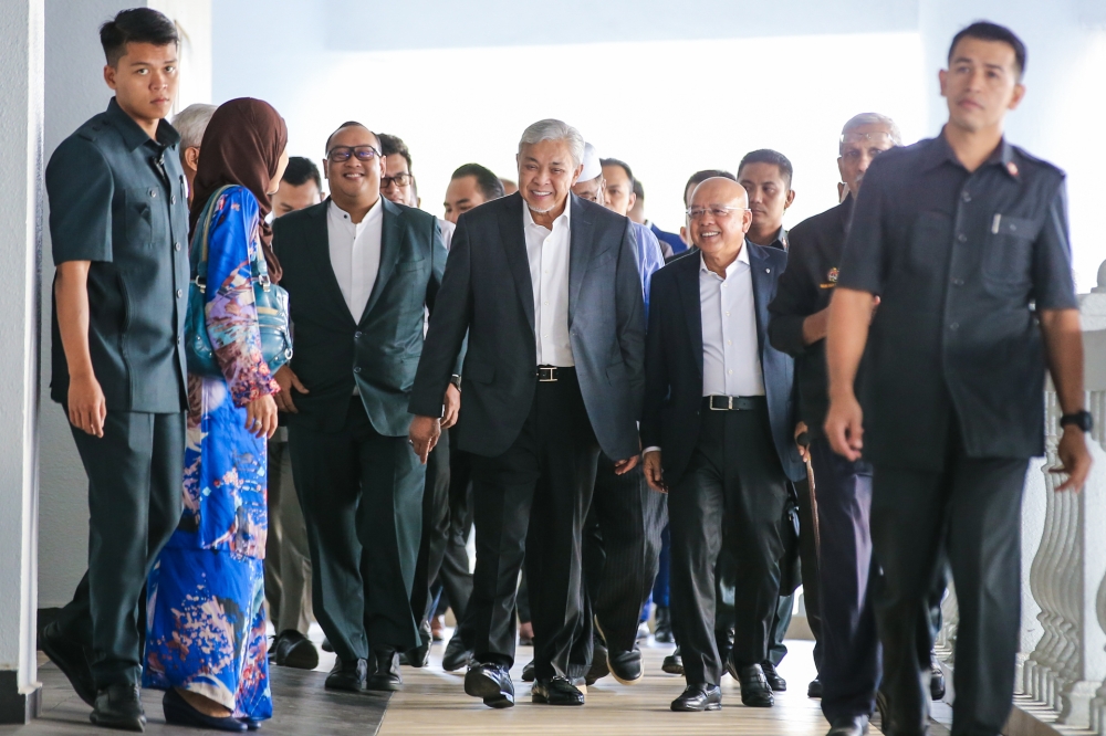 Datuk Seri Ahmad Zahid Hamidi (centre) arrives at the Kuala Lumpur High court for the Yayasan AKalbudi trial August 1, 2023. —Picture by Ahmad Zamzahuri 