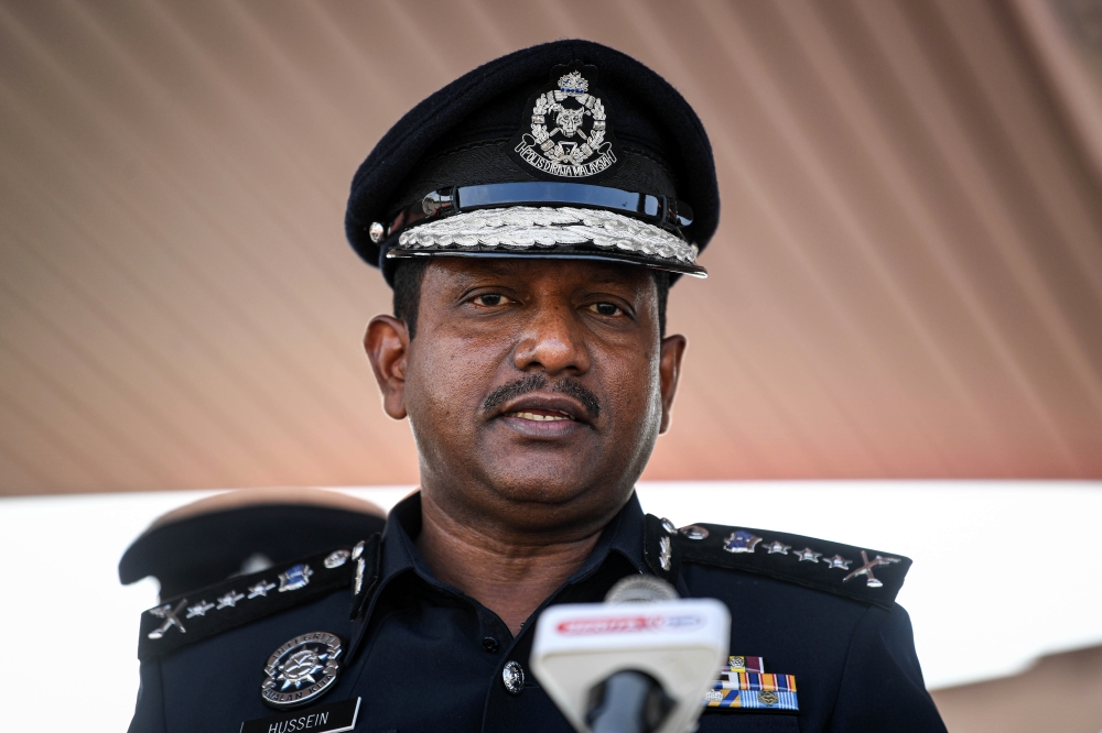 Selangor police chief Datuk Hussein Omar Khan speaks to the media after attending Sime Darby Property Bhd’s Auxiliary Police Unit’s 7th anniversary parade at Padang Kawad Universiti Putra Malaysia in Serdang August 1, 2023. — Bernama pic