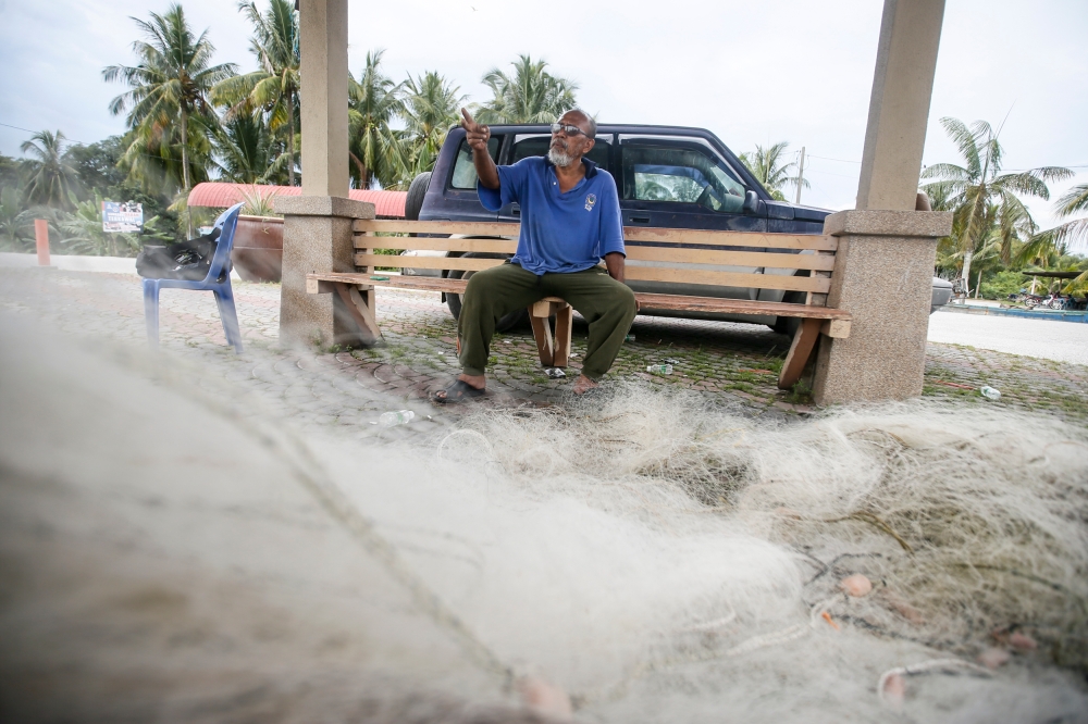 Local fisherman Mohamad Azam Shariat, 63, said Datuk Muslimin Yahaya has been accessible to Sungai Panjang residents needing his aid. — Picture by Hari Anggara