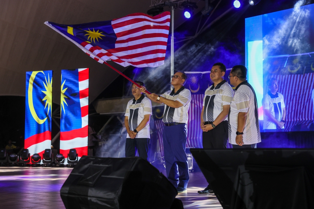 Pahang Menteri Besar Datuk Seri Wan Rosdy Wan Ismail (second from left) during the launch of the state-level Fly the Jalur Gemilang 2023 ceremony at Dataran Bandar Diraja Pekan August 1, 2023. — Bernama pic