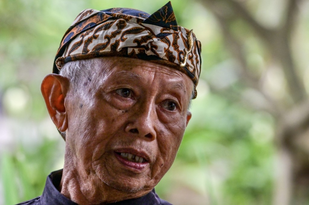 In this picture taken on July 6, 2023, Subrata, a member of the Sunda Wiwitan faith, speaks to AFP during an interview at Cigugur village in Kuningan, ahead of the Seren Taun ceremony to thank ancestors for the harvest and prosperity. — AFP pic