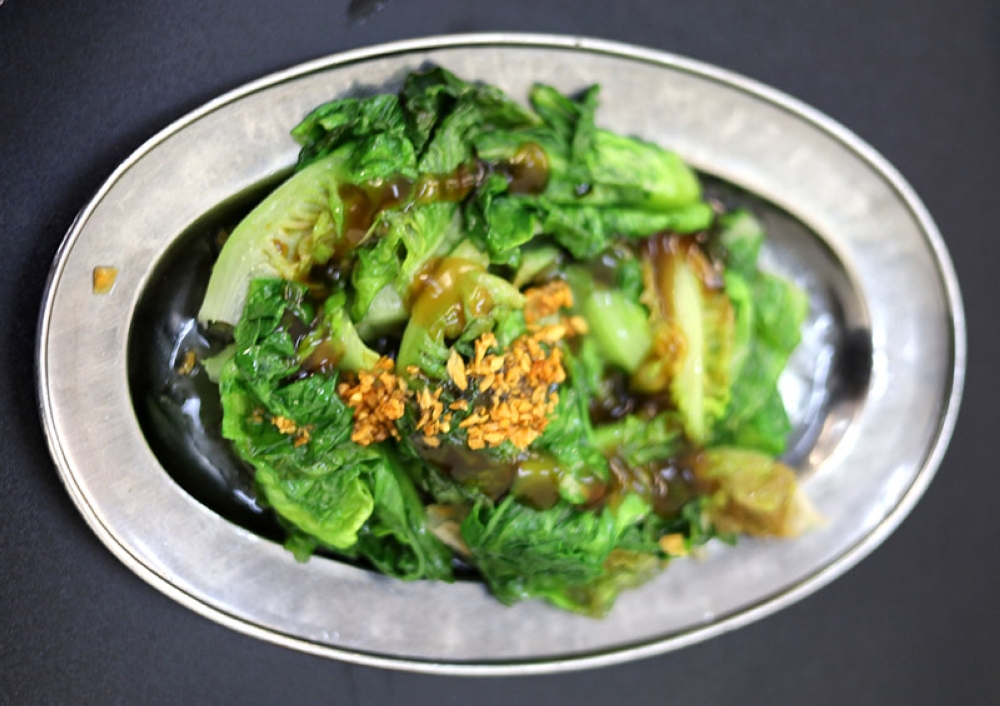 Yes, there must be a plate of greens like this blanched romaine lettuce topped with oyster sauce