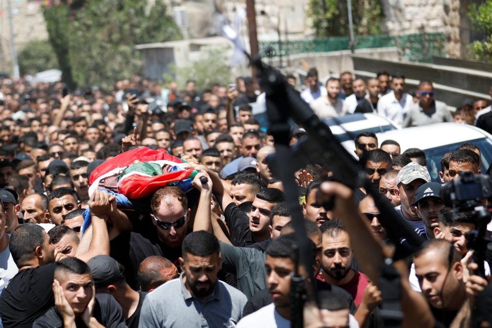 At Saturday’s funeral, Palestinian mourners carried Maatan’s body through the streets wrapped in a black and white keffiyeh headscarf and a Palestinian flag. — Reuters pic
