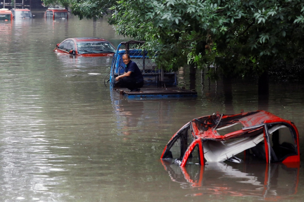 As of 8am on Friday, Hebei had relocated more than 1.54 million people, including 961,200 from flood storage areas, state media reported yesterday. — Reuters pic