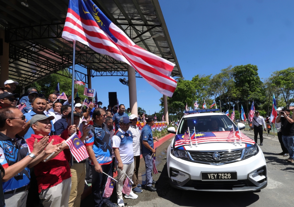 Sabah Chief Minister Datuk Seri Hajiji Noor waves off the convoy at the district-level 2023 Jalur Gemilang Merdeka Kembara programme in Tuaran  August 6, 2023. — Bernama pic