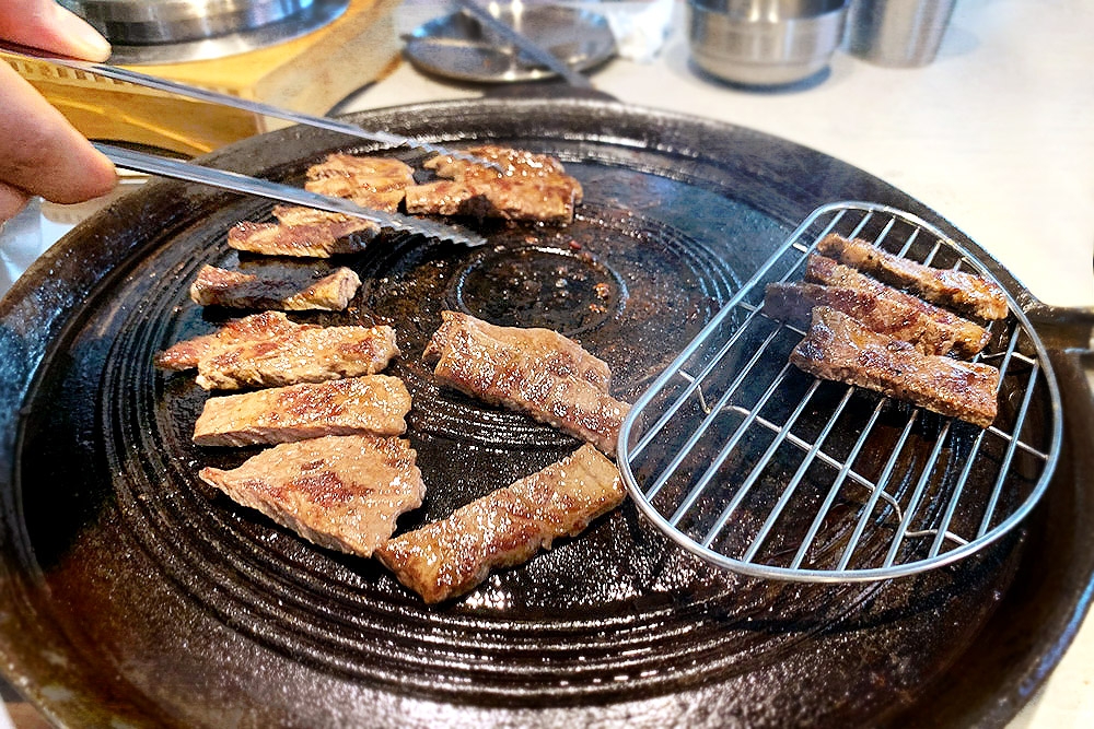 Grilling the beef boneless short ribs.