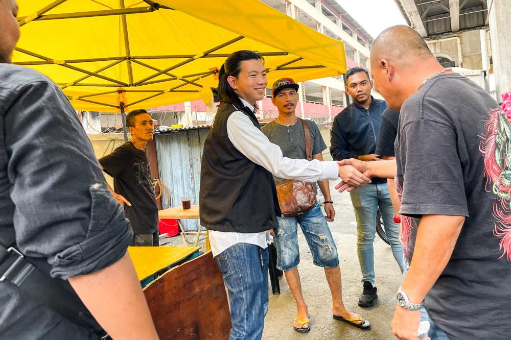 Dobby Chew (centre) meets residents during a walkabout at Bandar Sunway.