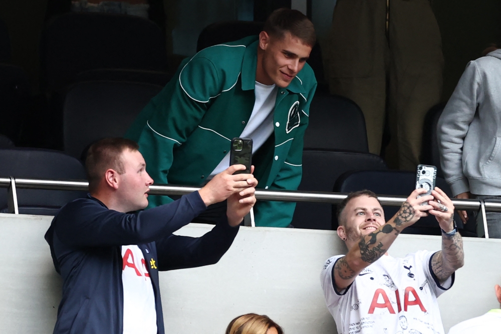 Tottenham fans take selfie photographs with new signing Dutch defender Micky van de Ven during the pre-season friendly football match between Tottenham Hotspur and Shakhtar Donetsk at the Tottenham Hotspur Stadium, in London, on August 6, 2023. — AFP pic 