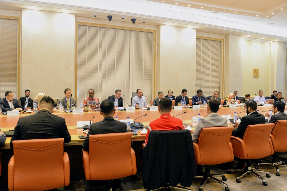 Prime Minister Datuk Seri Anwar Ibrahim, in a statement yesterday, said p-hailing companies had given their commitment to be more transparent and to study further the views of the riders in the calculation of payment rates for them. — Picture courtesy of Prime Minister’s Office