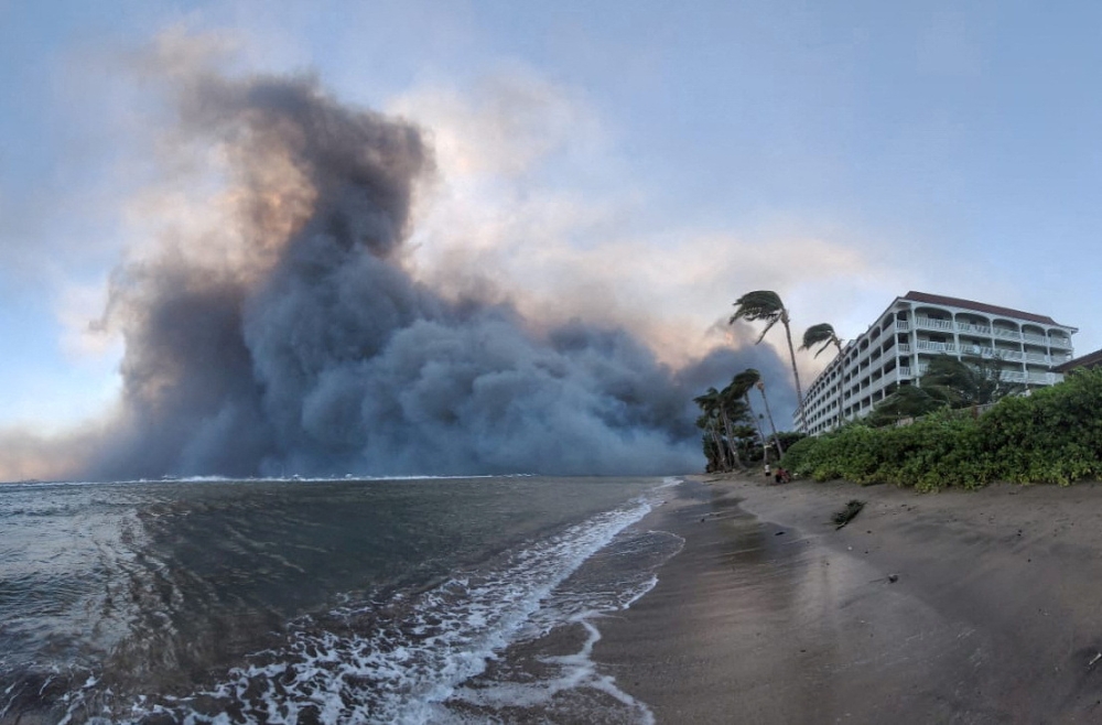 Smoke billows near Lahaina as wildfires destroyed a large part of the historic town of Lahaina. — Reuters pic