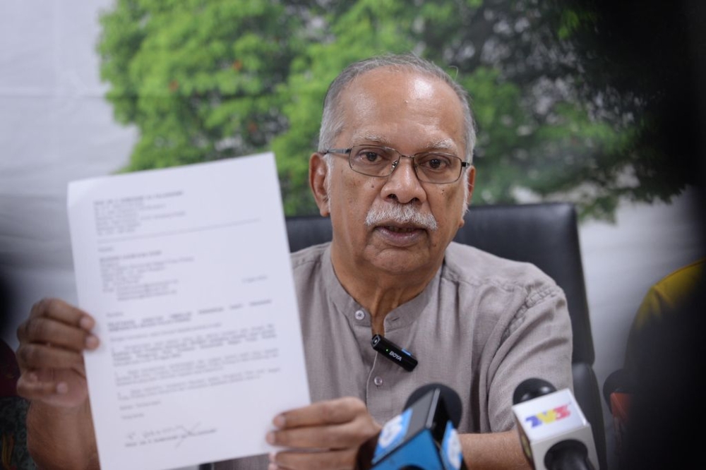 Prof Dr P. Ramasamy showing his resignation letter from the DAP, Penang, August 10, 2023. — Picture by KE Ooi