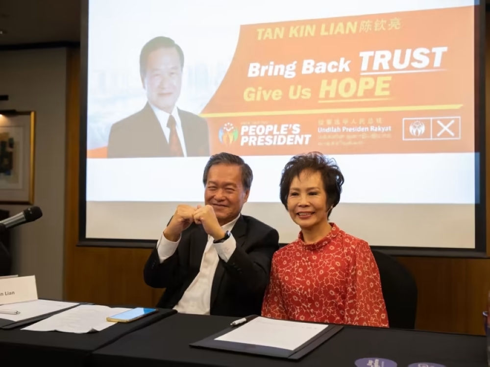 Tan Kin Lian and wife Tay Siew Hong after a press conference at Copthorne King’s Hotel on Aug 11, 2023. — TODAY pic