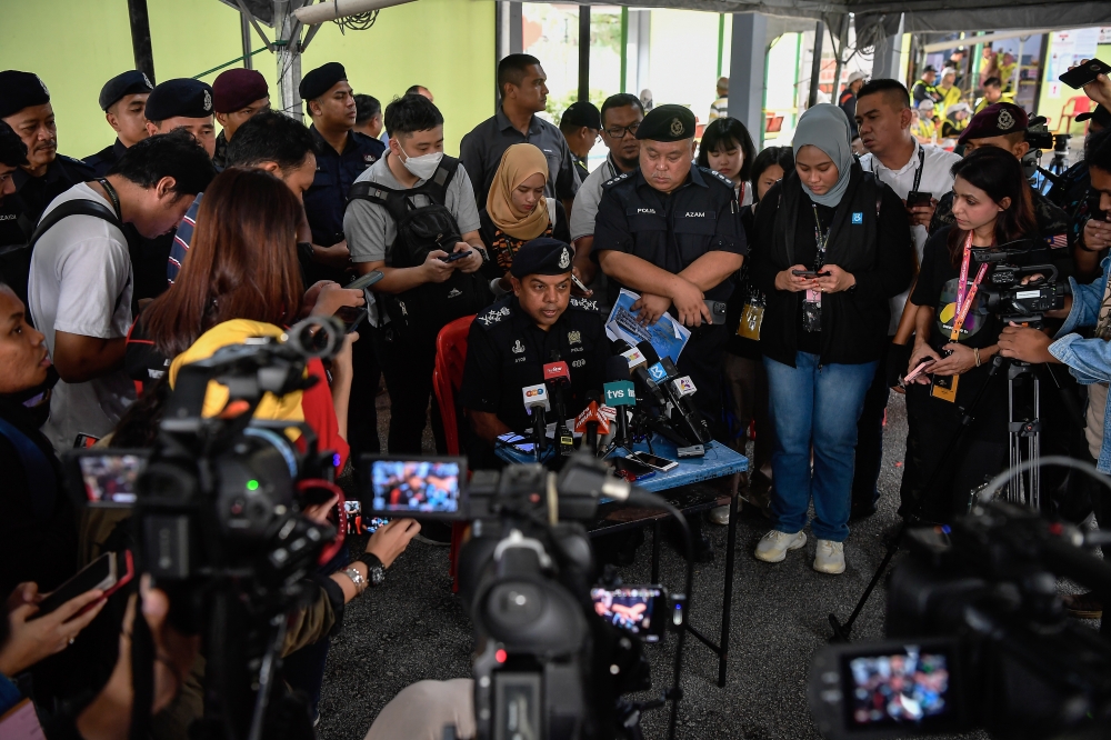 Deputy Inspect General of Police Datuk Seri Ayob Khan Mydin Pitchay (centre) speaks at a press conference at Sekolah Kebangsaan Klang Gate in Kuala Lumpur August 12, 2023. — Bernama pic
