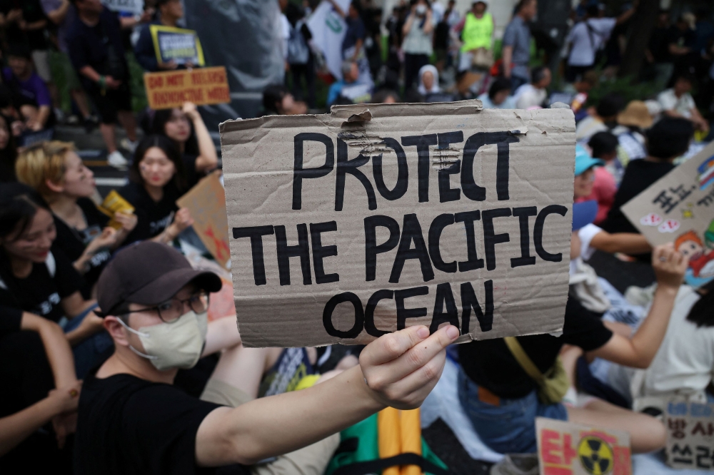 South Korean activists take part in a protest against Japan’s plan to release treated wastewater from the Fukushima nuclear power plant into the ocean, in central Seoul, South Korea, August 12, 2023. — Reuters pic