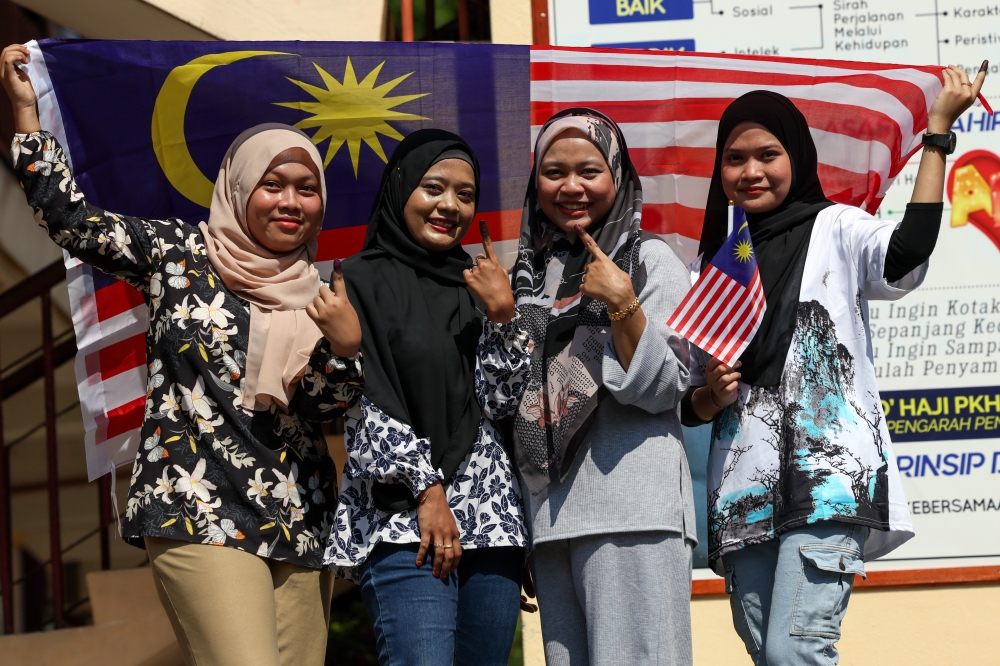 Young voters pose for a photo after voting in Bukit Besar, Kuala Terengganu August 12, 2023. — Bernama pic