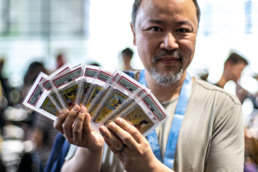 Pokemon fan Jeffrey Ng visits the dedicated trade area during the 2023 Pokemon World Championships in Yokohama on August 11, 2023. — AFP pic