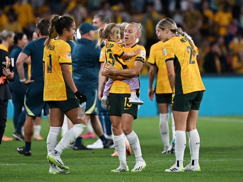 Australia's Tameka Yallop and her daughter Harley Rose celebrate on the pitch after the match against New Zealand at the Brisbane Stadium August 12, 2023. — Reuters pic
