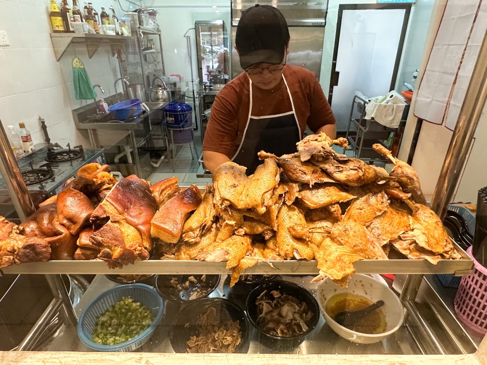 The focus of this restaurant is the window to the kitchen and its array of braised items from various parts of the pig and duck. — Pictures by Lee Khang Yi