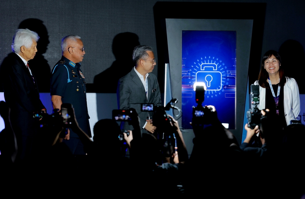 Communications and Digital Minister Fahmi Fadzil and Deputy Communications and Digital Minister Teo Nie Ching at the CyberDSA 2023 event in Kuala Lumpur Convention Centre, August 15, 2023. — Bernama pic 