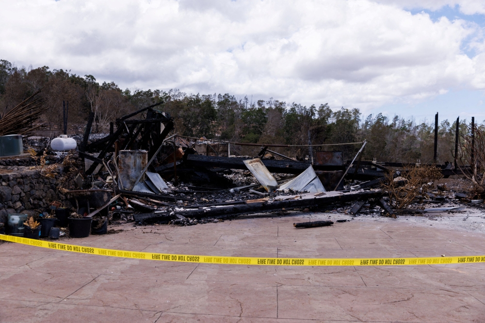 A view of the remains of a building after it was destroyed during wildfires, in Kula, Maui island, Hawaii August 13, 2023. — Reuters pic