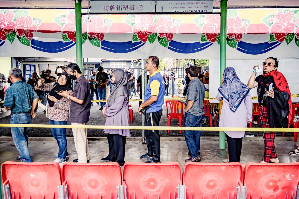 Voters queue up to cast their ballots at a polling centre in Selangor August 12, 2023. ― Picture by Firdaus Latif